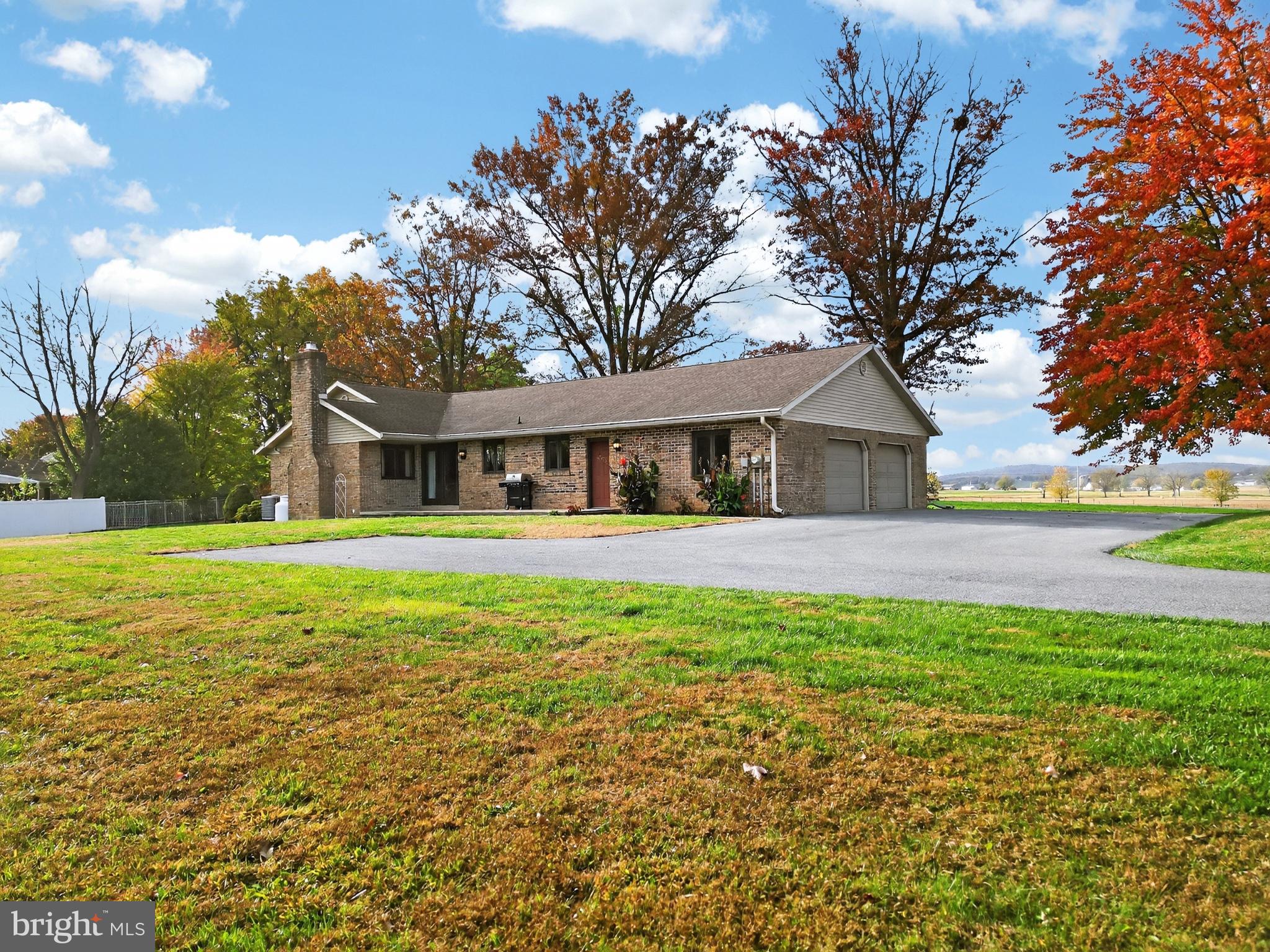 740 Lincoln Gardens Road Ephrata, PA 17522 - Photo 3 of 72 a front view of house with yard and trees in the background