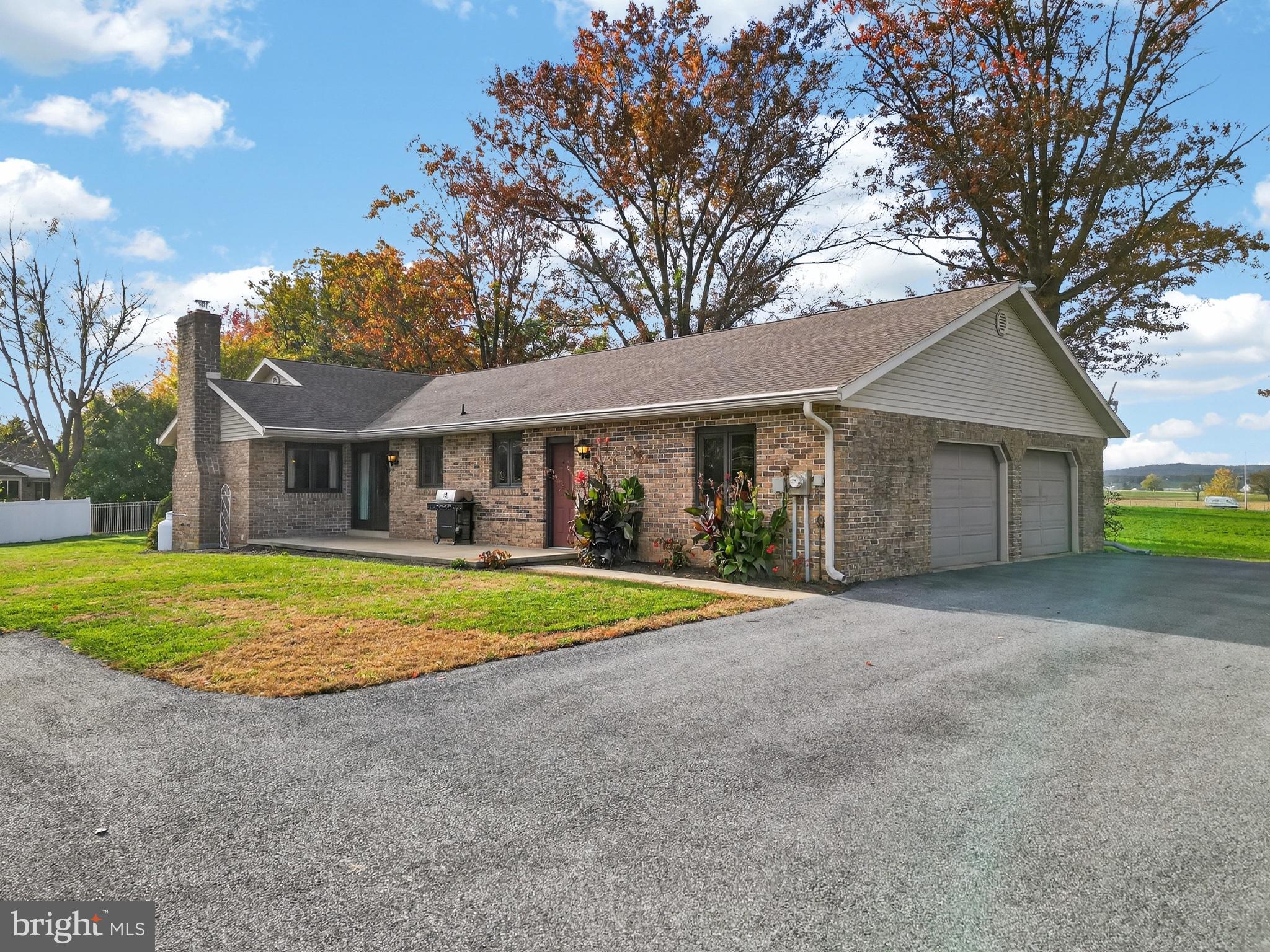 740 Lincoln Gardens Road Ephrata, PA 17522 - Photo 5 of 72 a front view of a house with a yard and garage