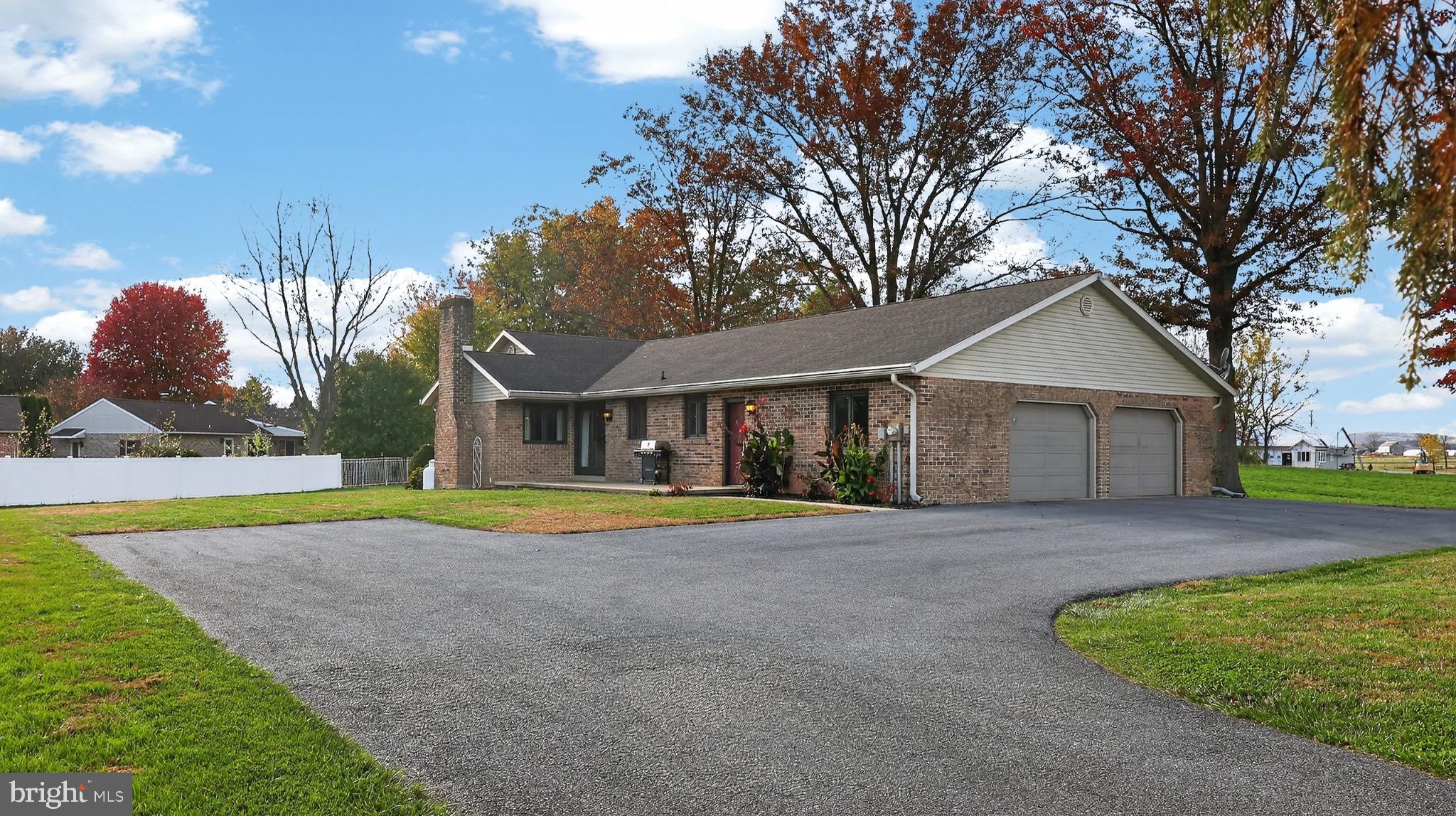 740 Lincoln Gardens Road Ephrata, PA 17522 - Photo 56 of 72 a front view of a house with a yard and trees