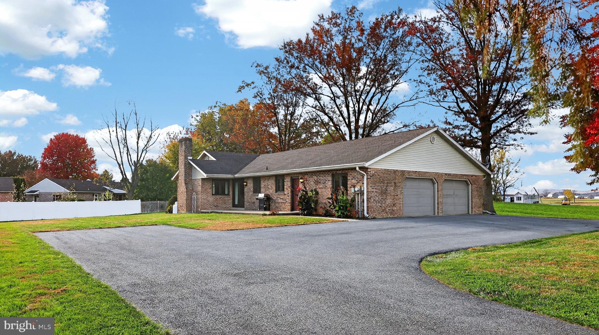 740 Lincoln Gardens Road Ephrata, PA 17522 - Photo 57 of 72 a front view of a house with a yard and trees
