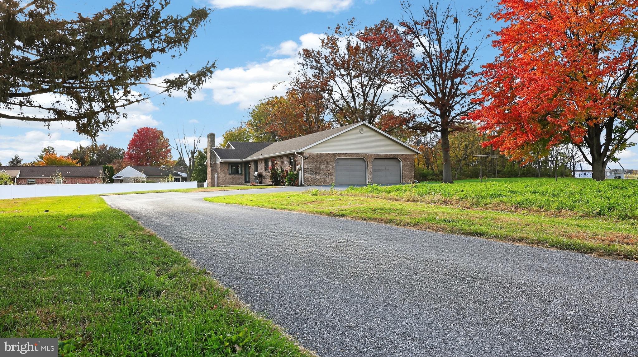 740 Lincoln Gardens Road Ephrata, PA 17522 - Photo 59 of 72 a view of a house with a yard and large trees