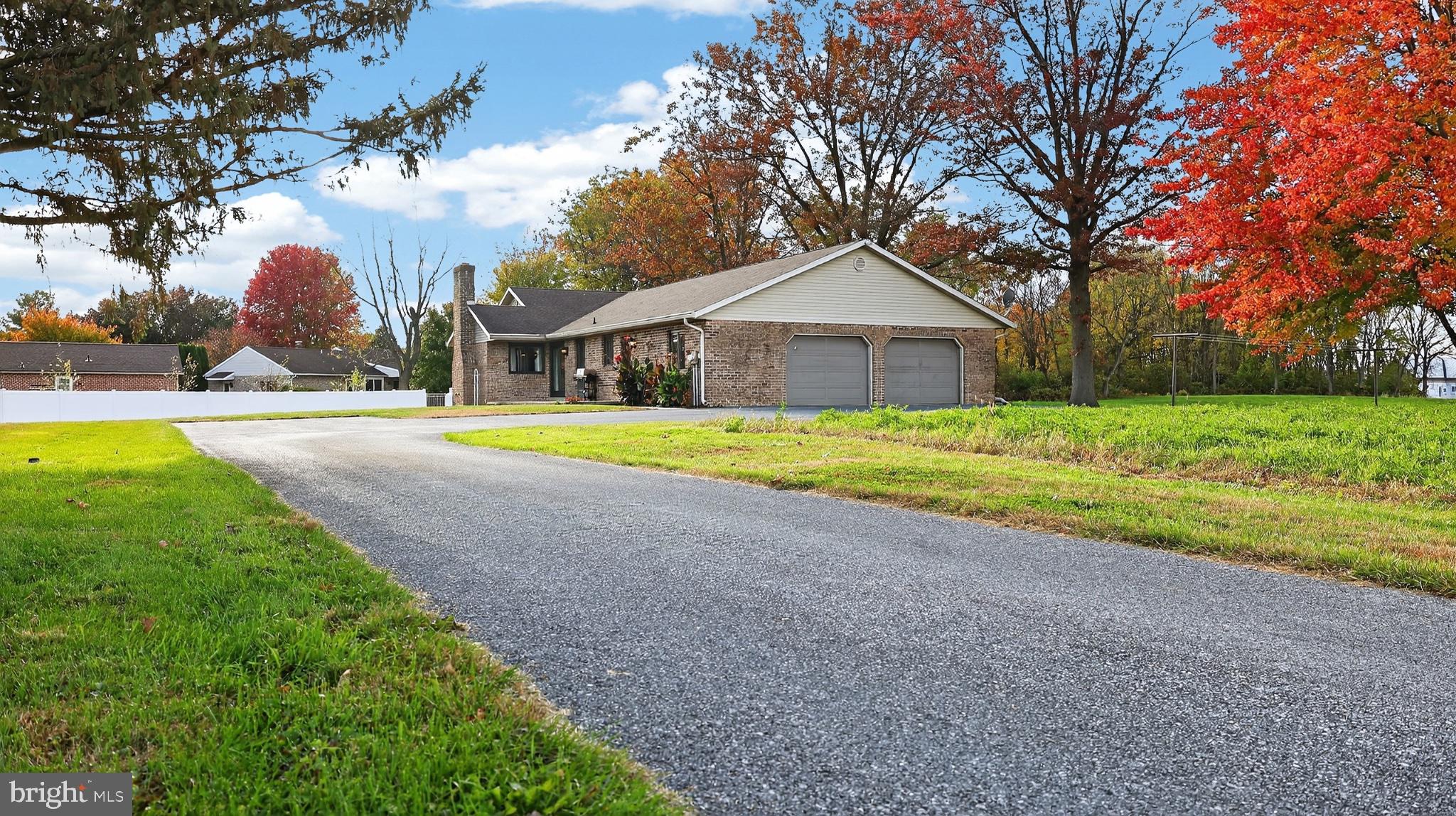 740 Lincoln Gardens Road Ephrata, PA 17522 - Photo 61 of 72 a front view of a house with a yard and garage