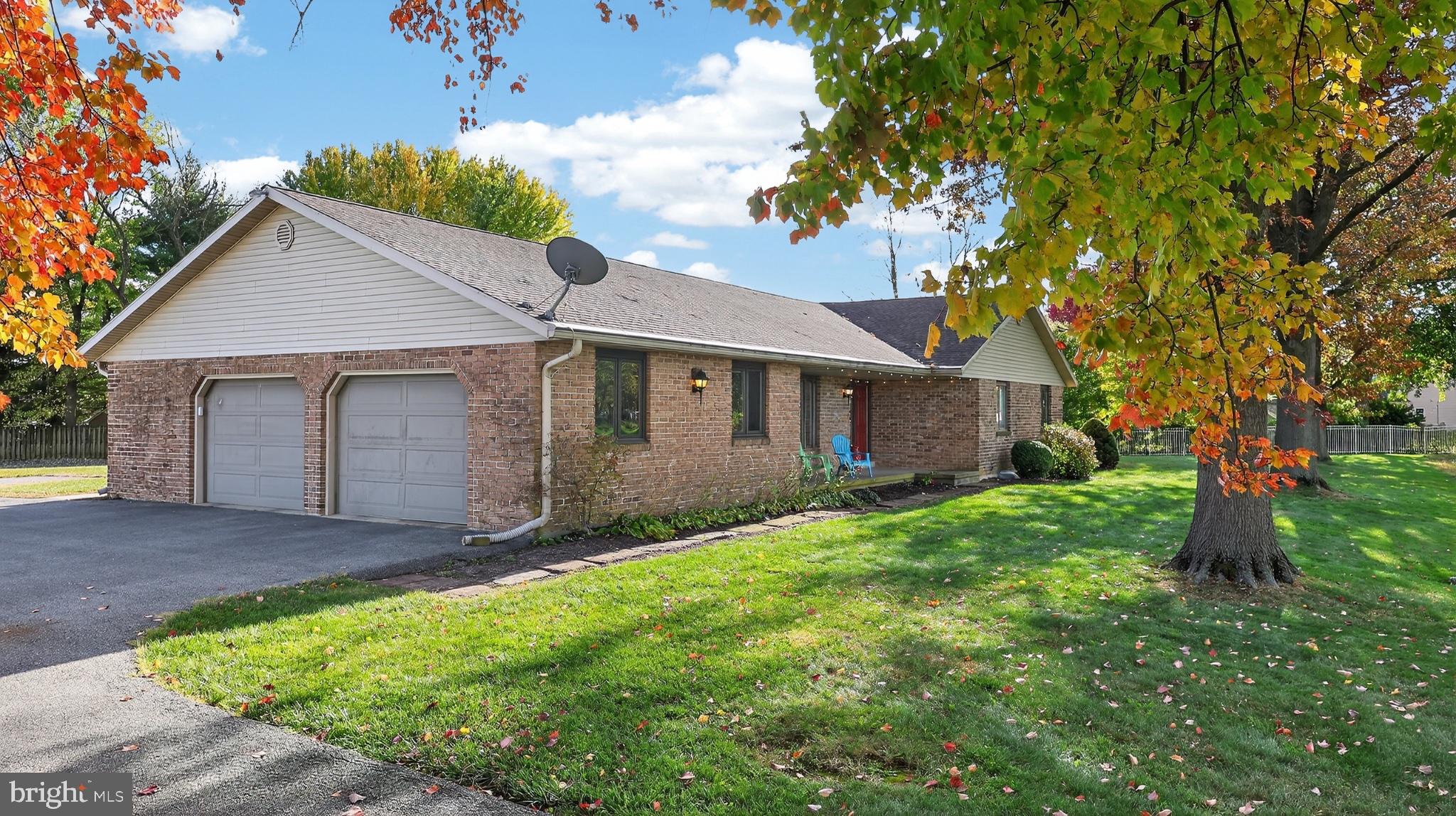 740 Lincoln Gardens Road Ephrata, PA 17522 - Photo 68 of 72 a view of a yard in front of a house with plants and large tree
