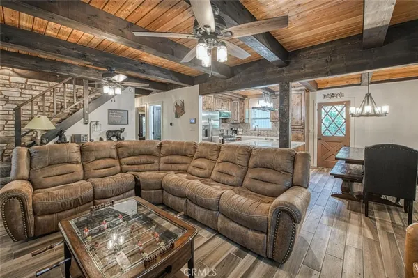 a kitchen with stainless steel appliances granite countertop a sink a stove and a refrigerator