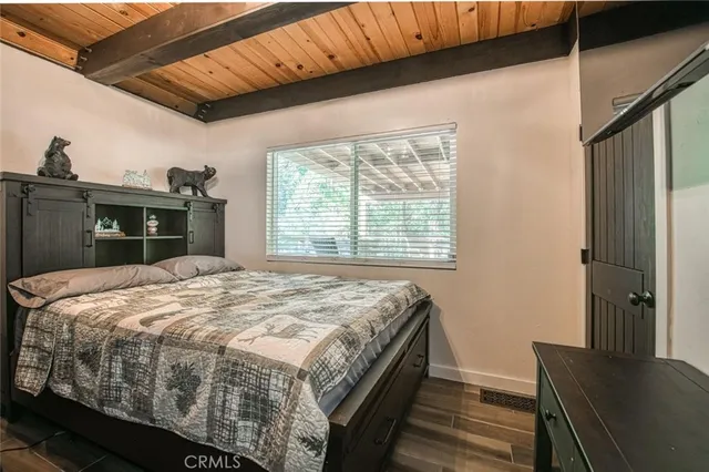 a outdoor space with lots of wooden furniture and a chandelier