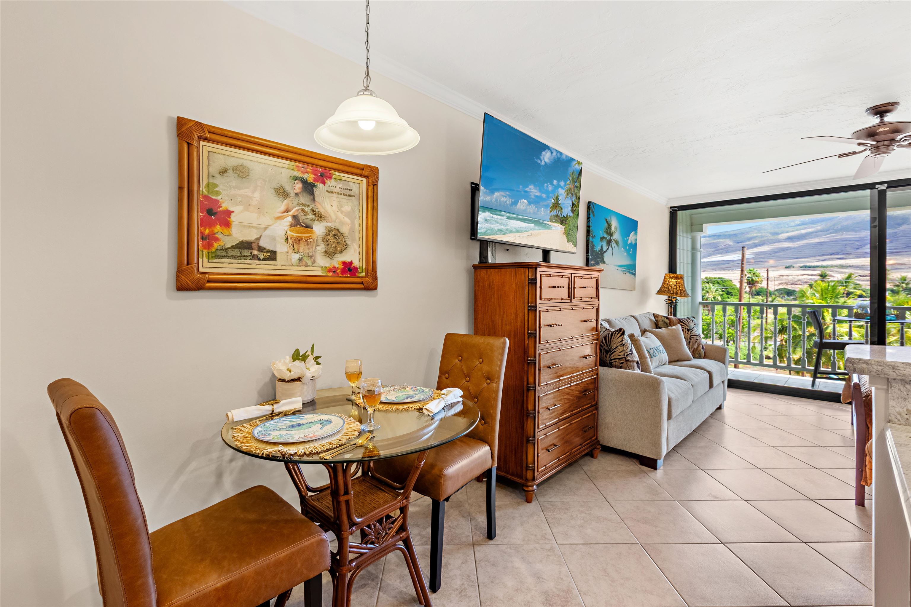 475 Front Street, Unit 430 Lahaina, HI 96761 - Photo 11 of 19 a living room with furniture a large window and a dining table