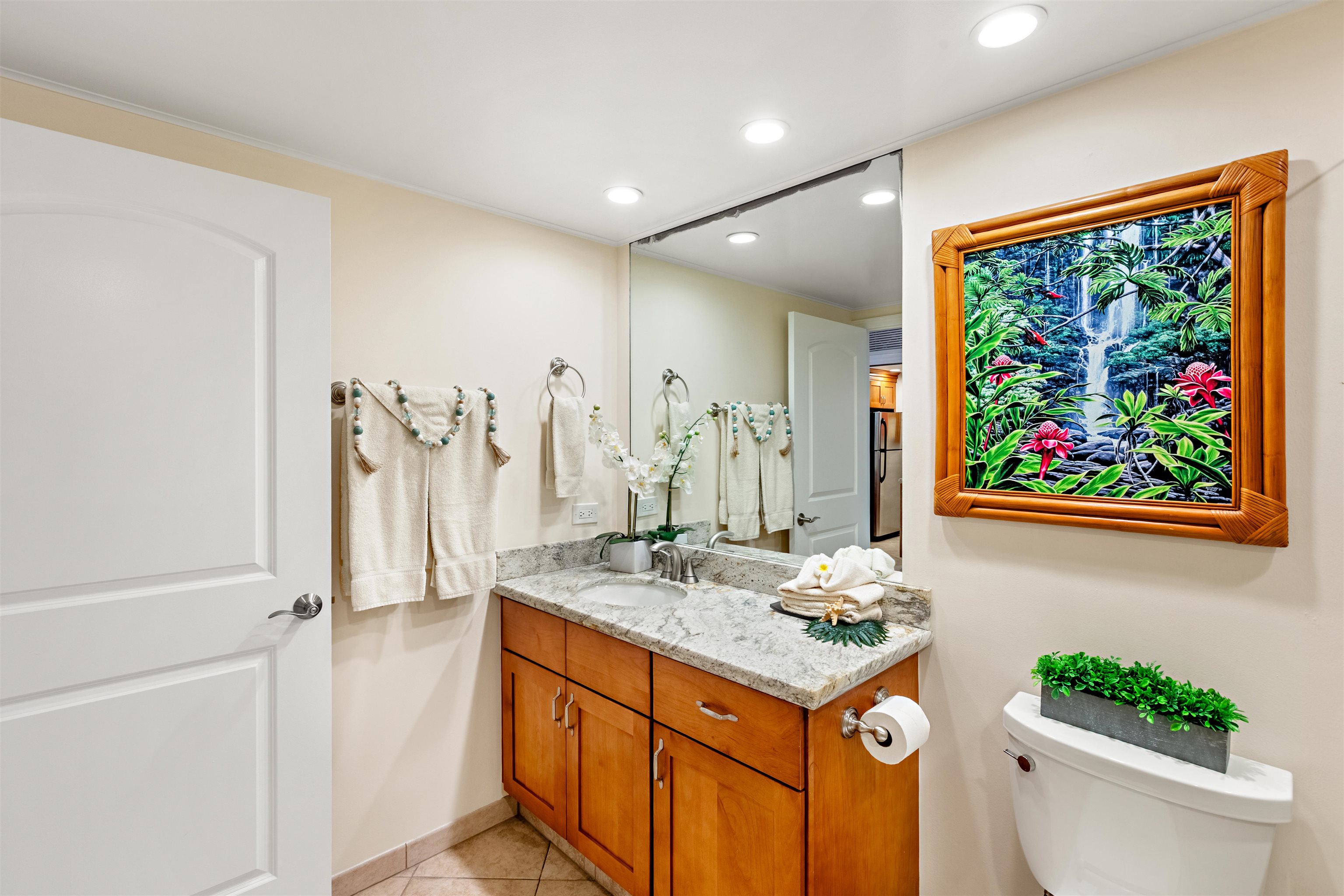 475 Front Street, Unit 430 Lahaina, HI 96761 - Photo 13 of 19 a bathroom with a granite countertop sink and a mirror