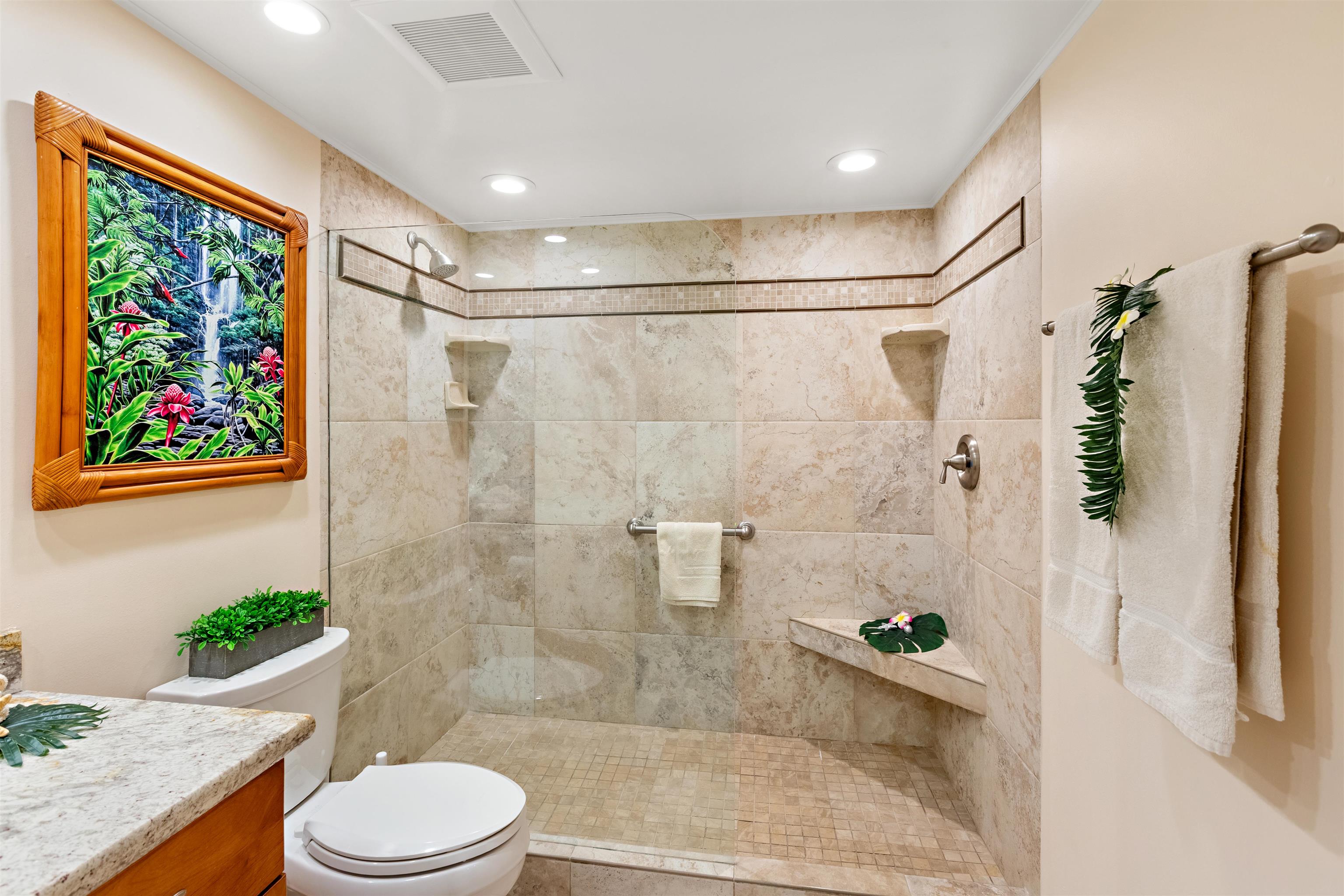 475 Front Street, Unit 430 Lahaina, HI 96761 - Photo 16 of 19 a bathroom with a granite countertop sink toilet and shower