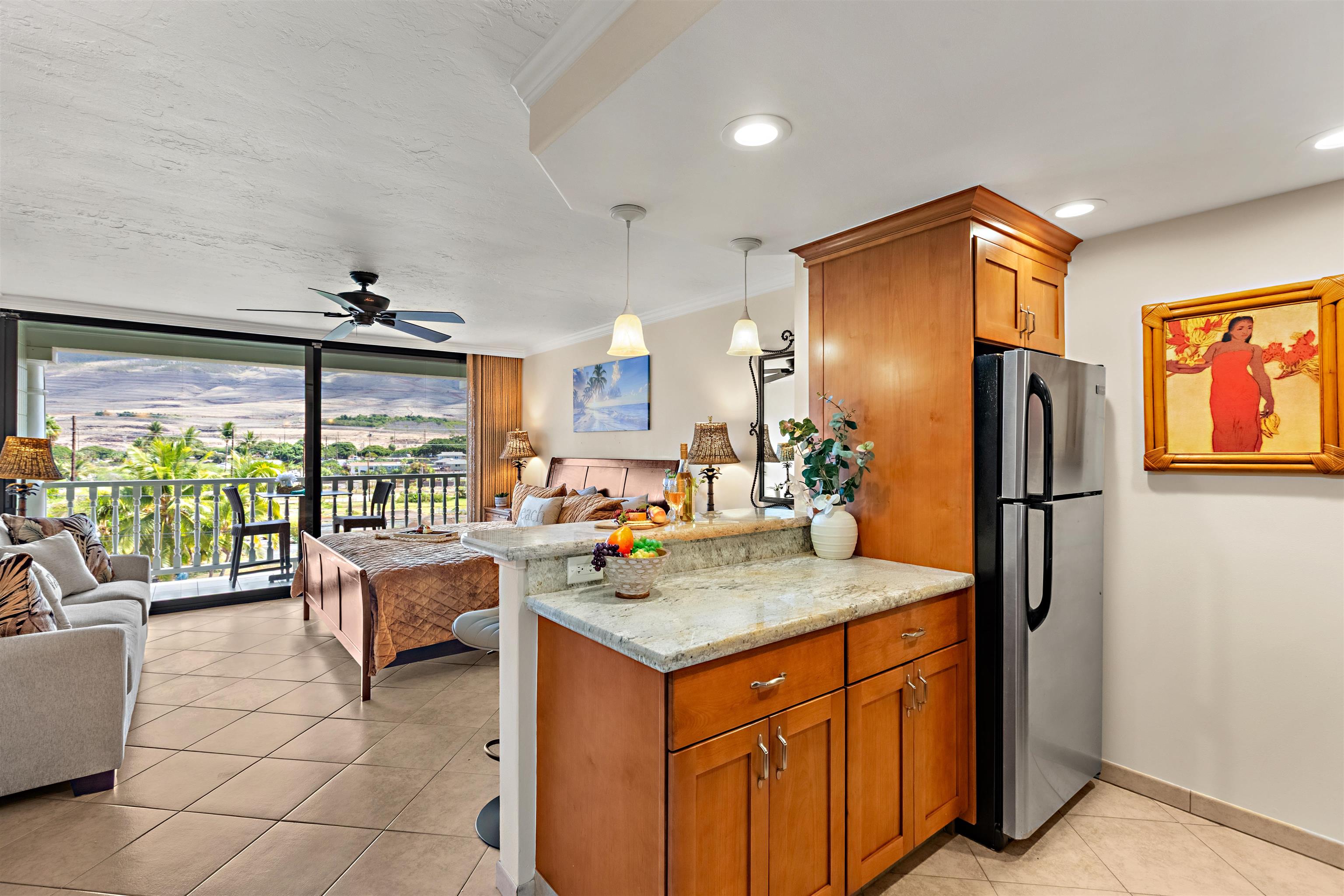 475 Front Street, Unit 430 Lahaina, HI 96761 - Photo 6 of 19 a kitchen with a refrigerator and a sink