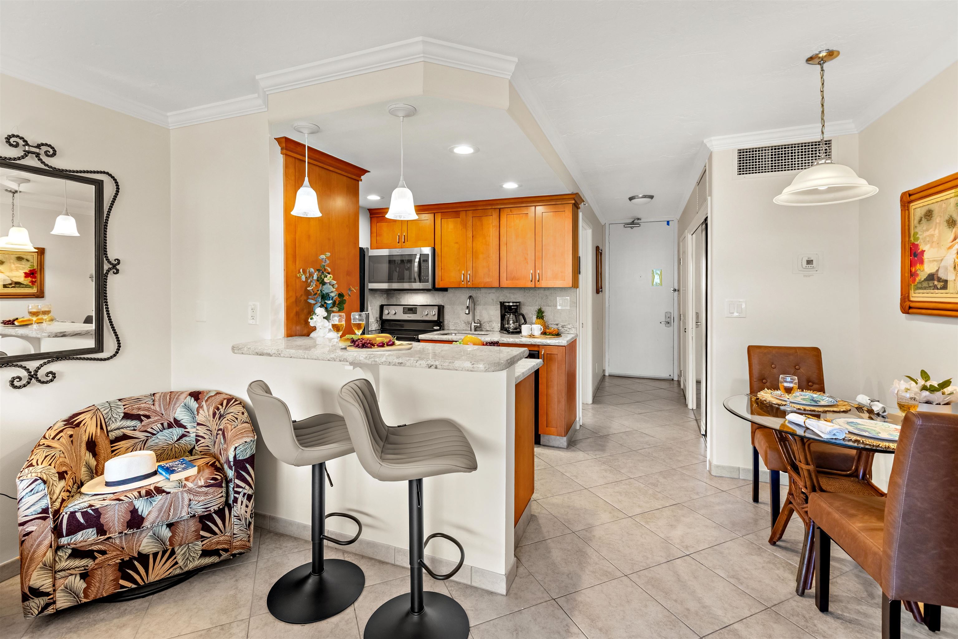 475 Front Street, Unit 430 Lahaina, HI 96761 - Photo 7 of 19 a living room with furniture and a flat screen tv
