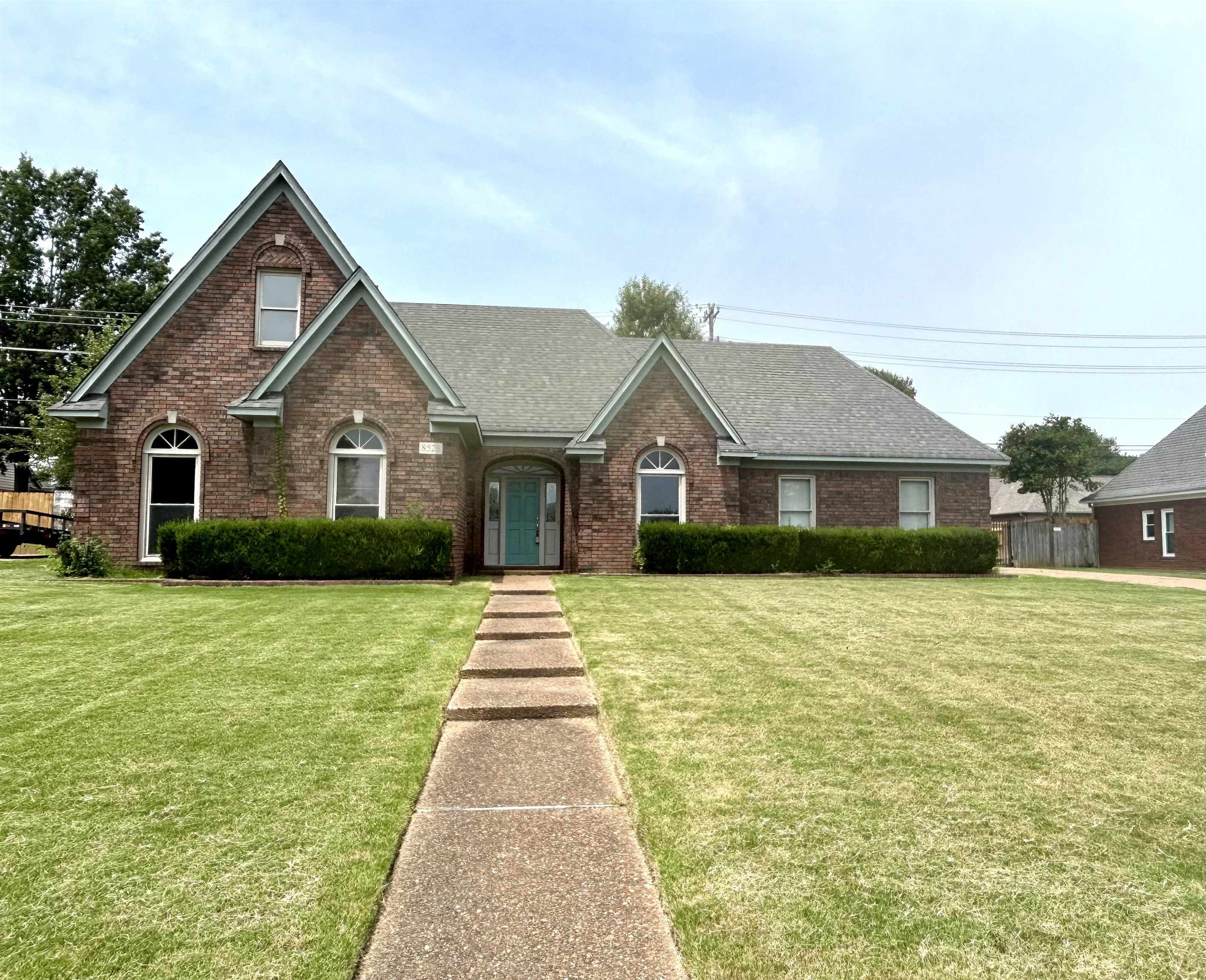 8528 Trinity Road Memphis, TN 38018 - Photo 1 of 21 a front view of a house with a yard