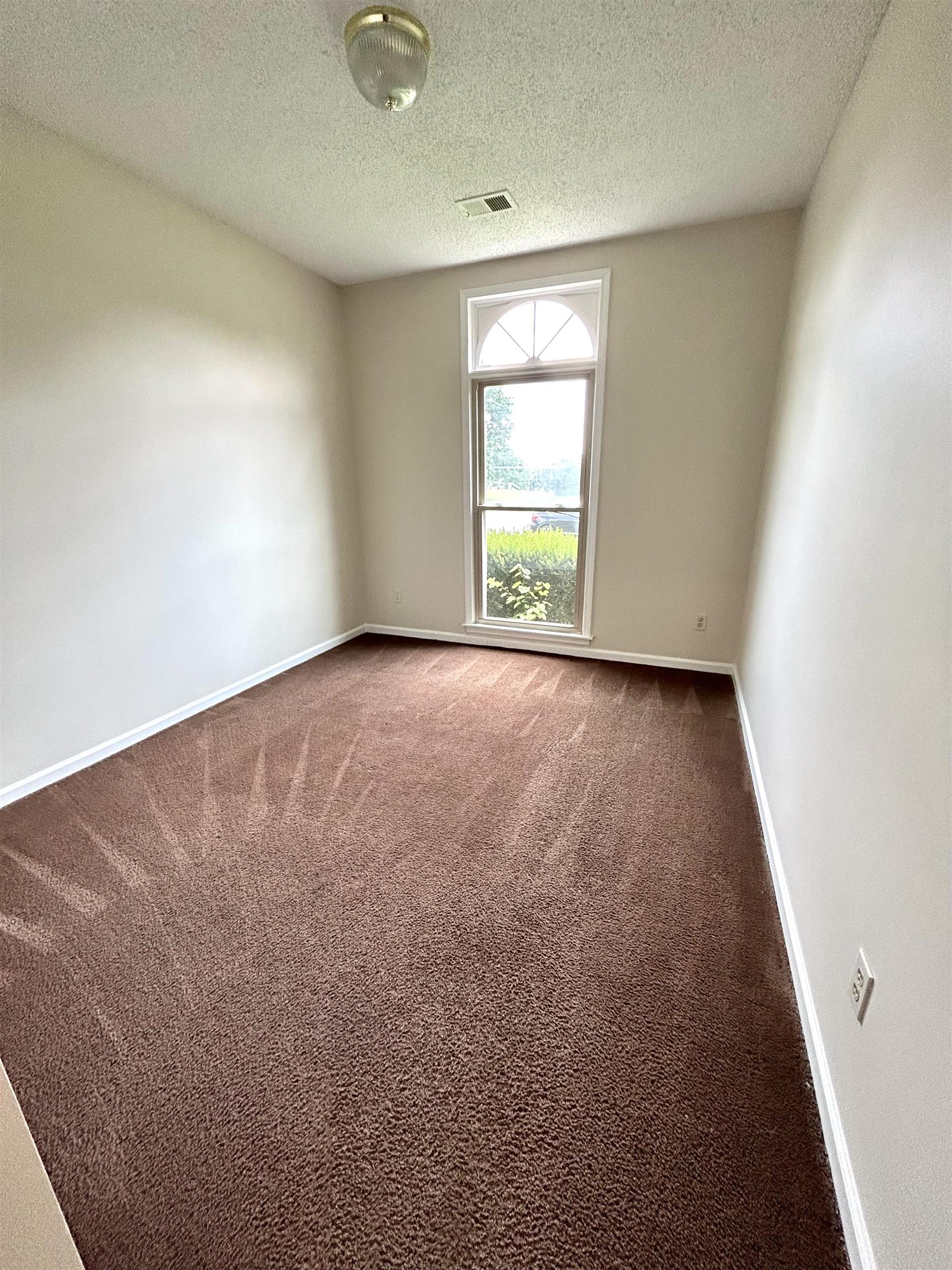 8528 Trinity Road Memphis, TN 38018 - Photo 12 of 21 an empty room with windows