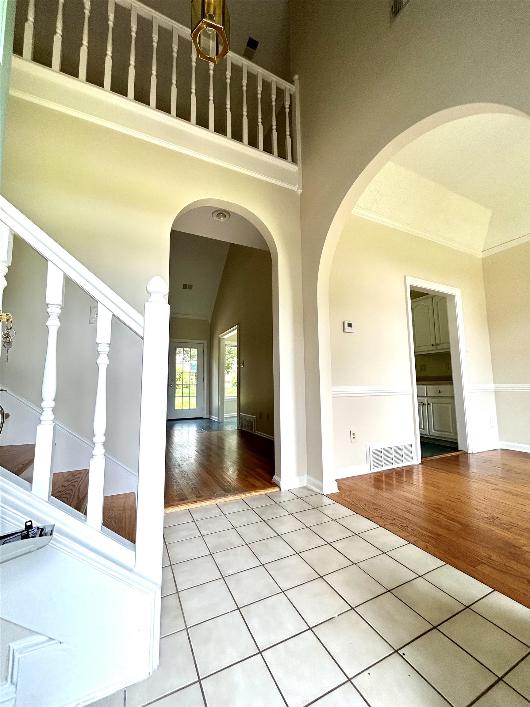 8528 Trinity Road Memphis, TN 38018 - Photo 2 of 21 a view of a hallway with wooden floor and windows