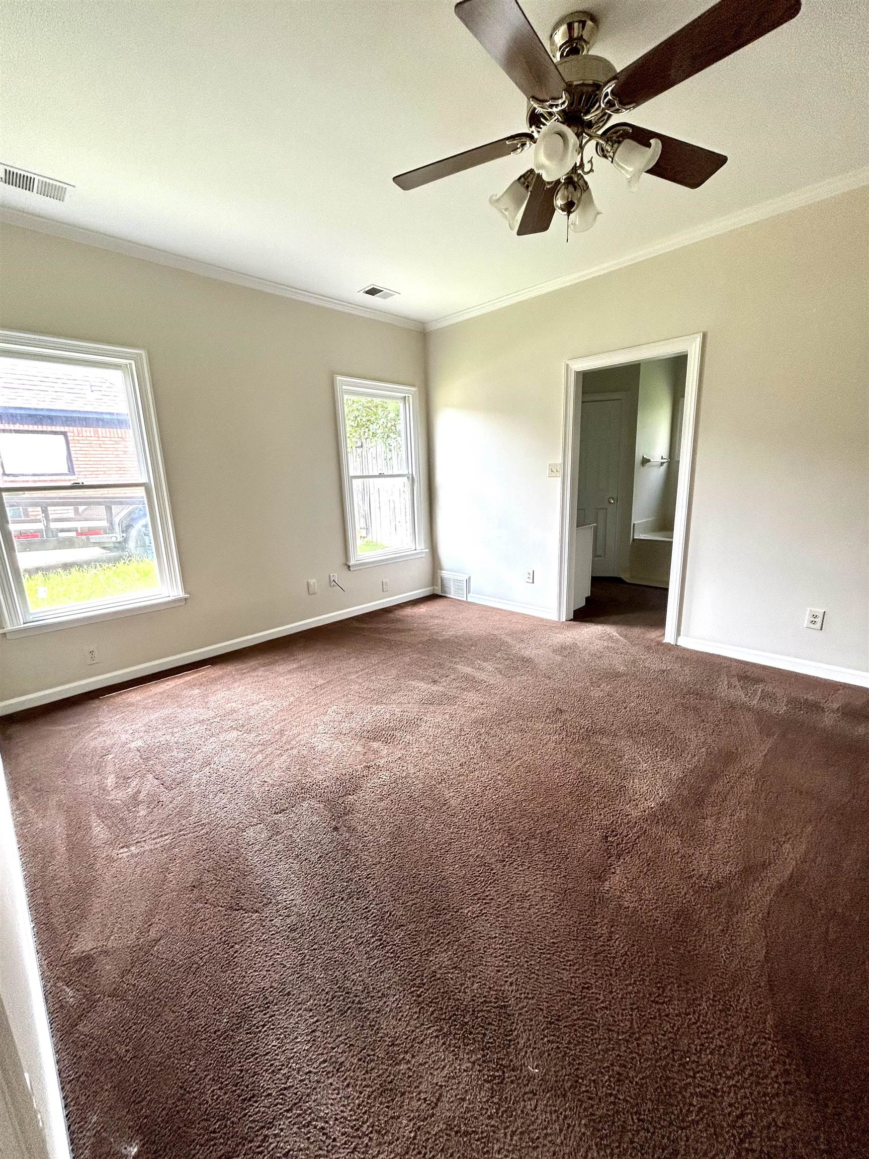 8528 Trinity Road Memphis, TN 38018 - Photo 10 of 21 a view of an empty room with a window
