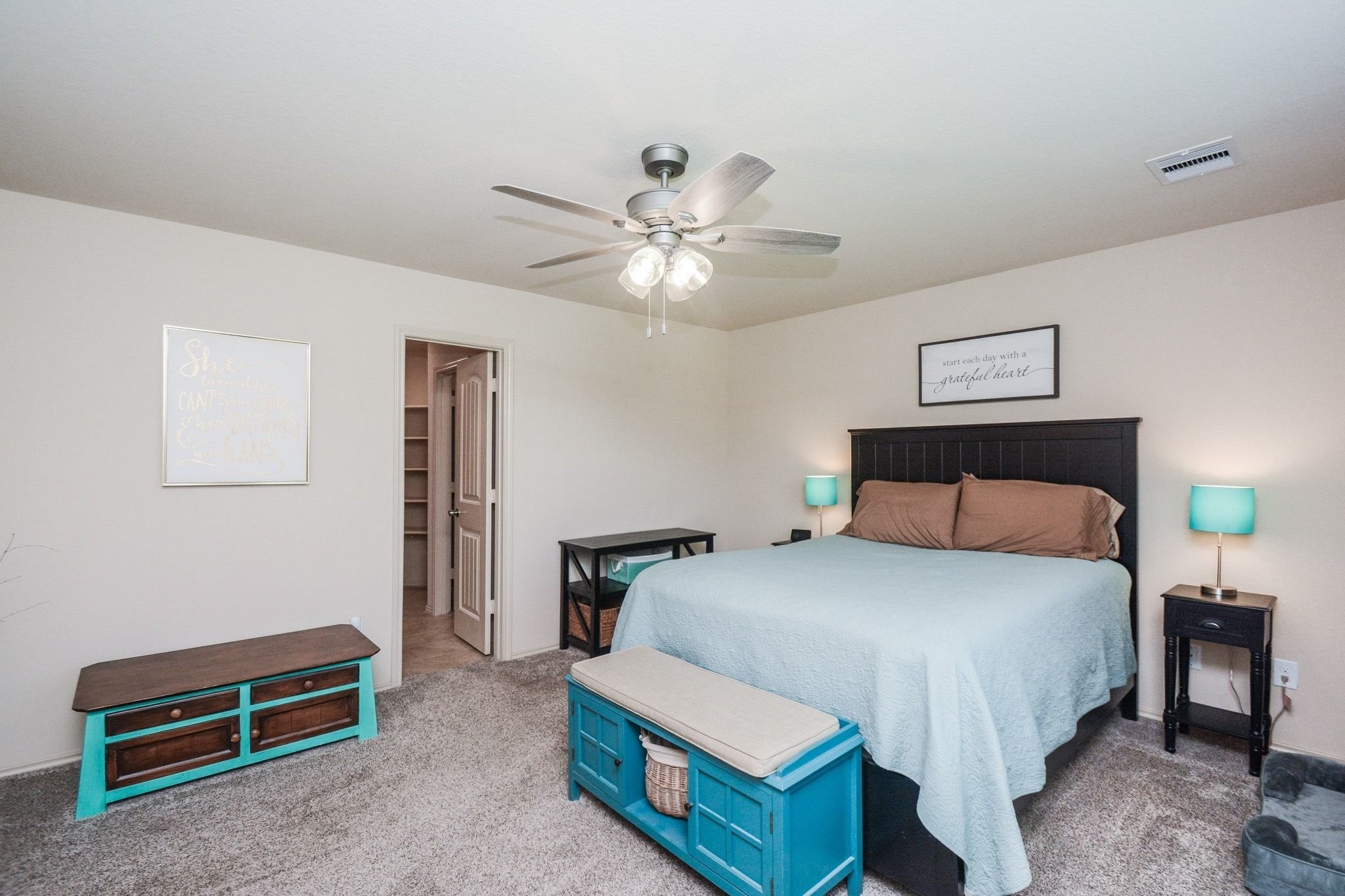 23318 Dukes Run Drive Spring, TX 77373 - Photo 4 of 41 This cozy bedroom features soft carpet, and a ceiling fan. The room has a warm and inviting atmosphere.