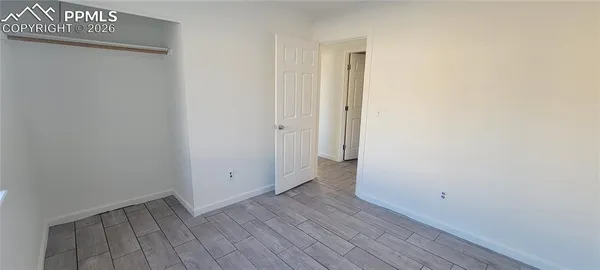 a white toilet sitting next to a bath tub and a shower