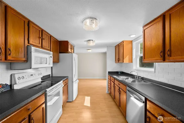 a kitchen with a refrigerator and cabinets