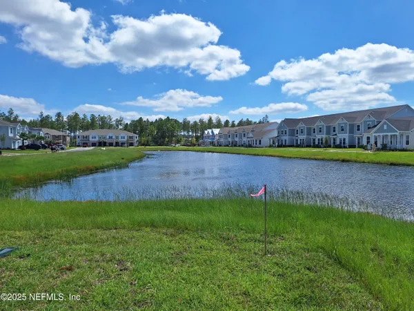 a view of a lake with a big yard