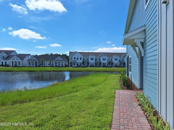 a view of a large garden with lawn chairs