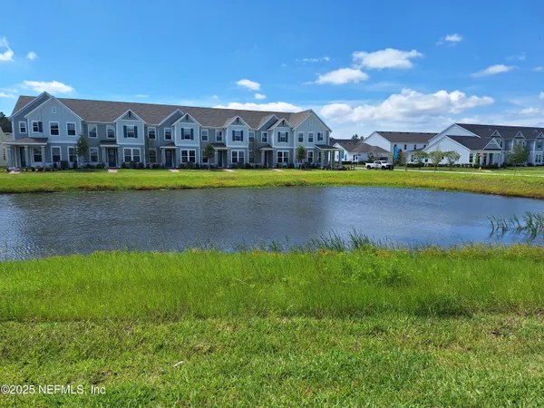 a view of an houses with a swimming pool