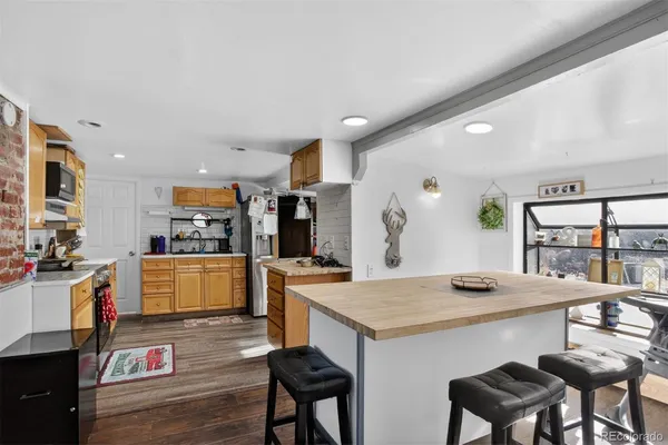 a kitchen with a table and chairs in it