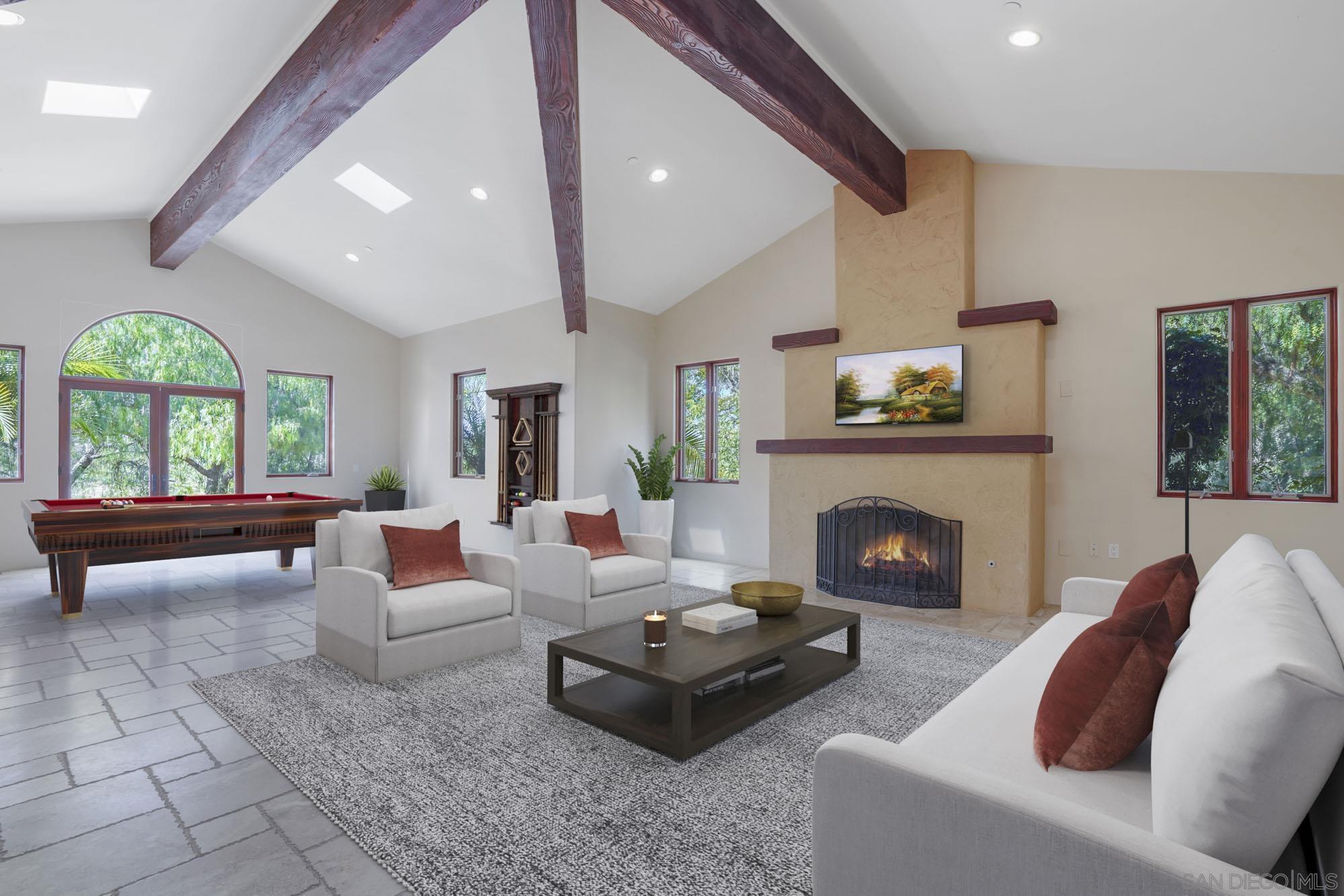 5352 Camino Jasmine Bonsall, CA 92003 - Photo 12 of 68 a living room with furniture and a fireplace