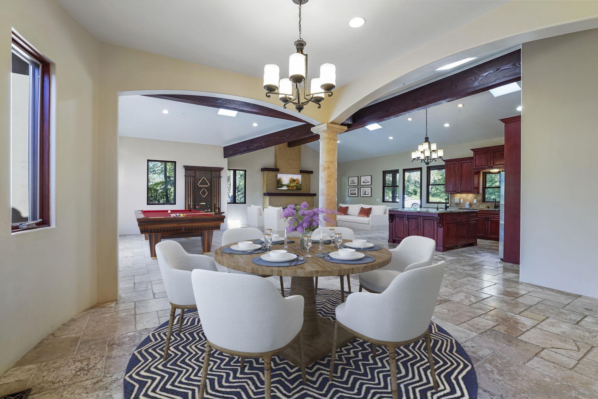 5352 Camino Jasmine Bonsall, CA 92003 - Photo 15 of 68 a dining room with furniture a chandelier and wooden floor