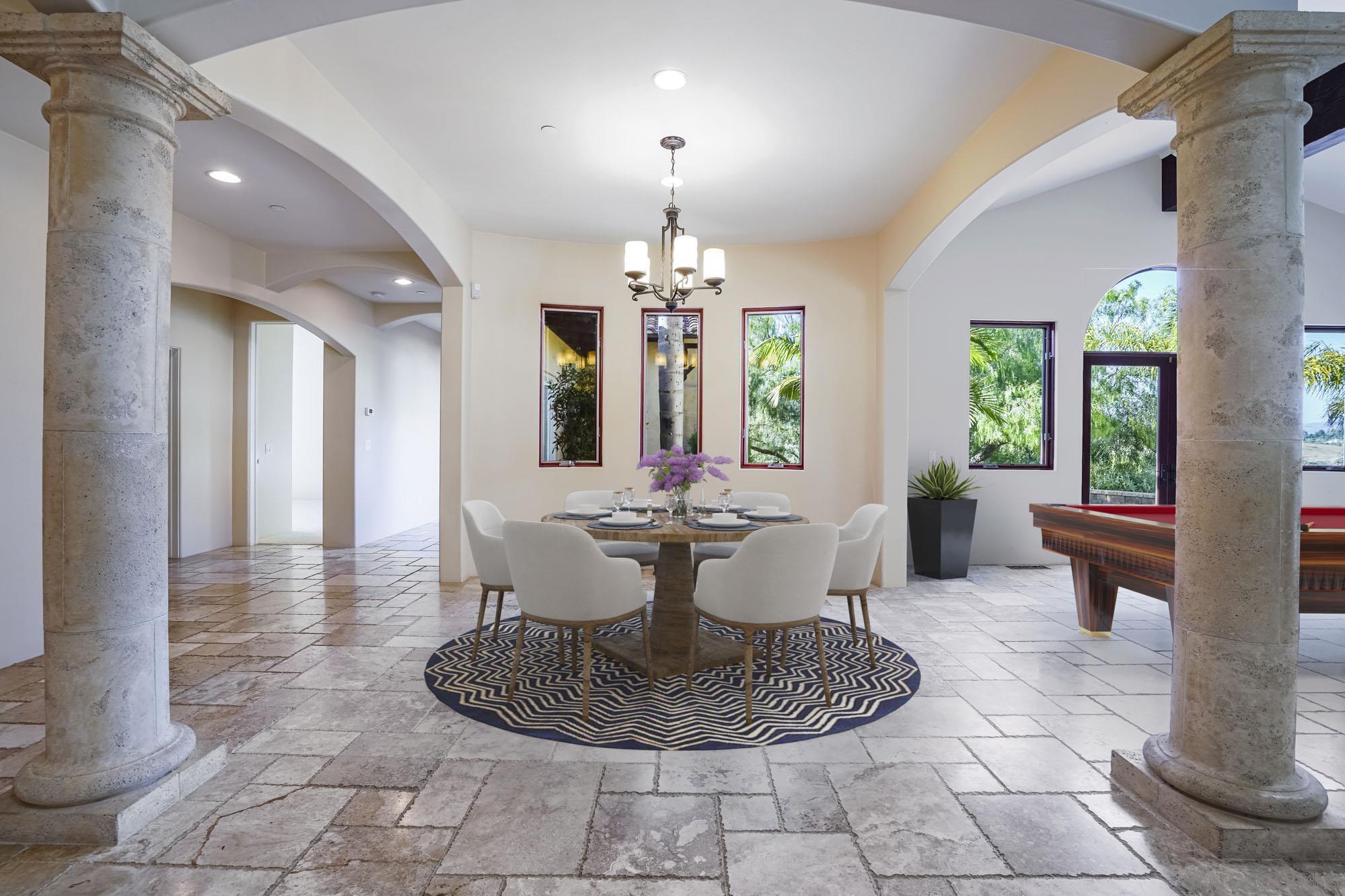 5352 Camino Jasmine Bonsall, CA 92003 - Photo 16 of 68 a view of a very nice looking dining room with a table and chandelier
