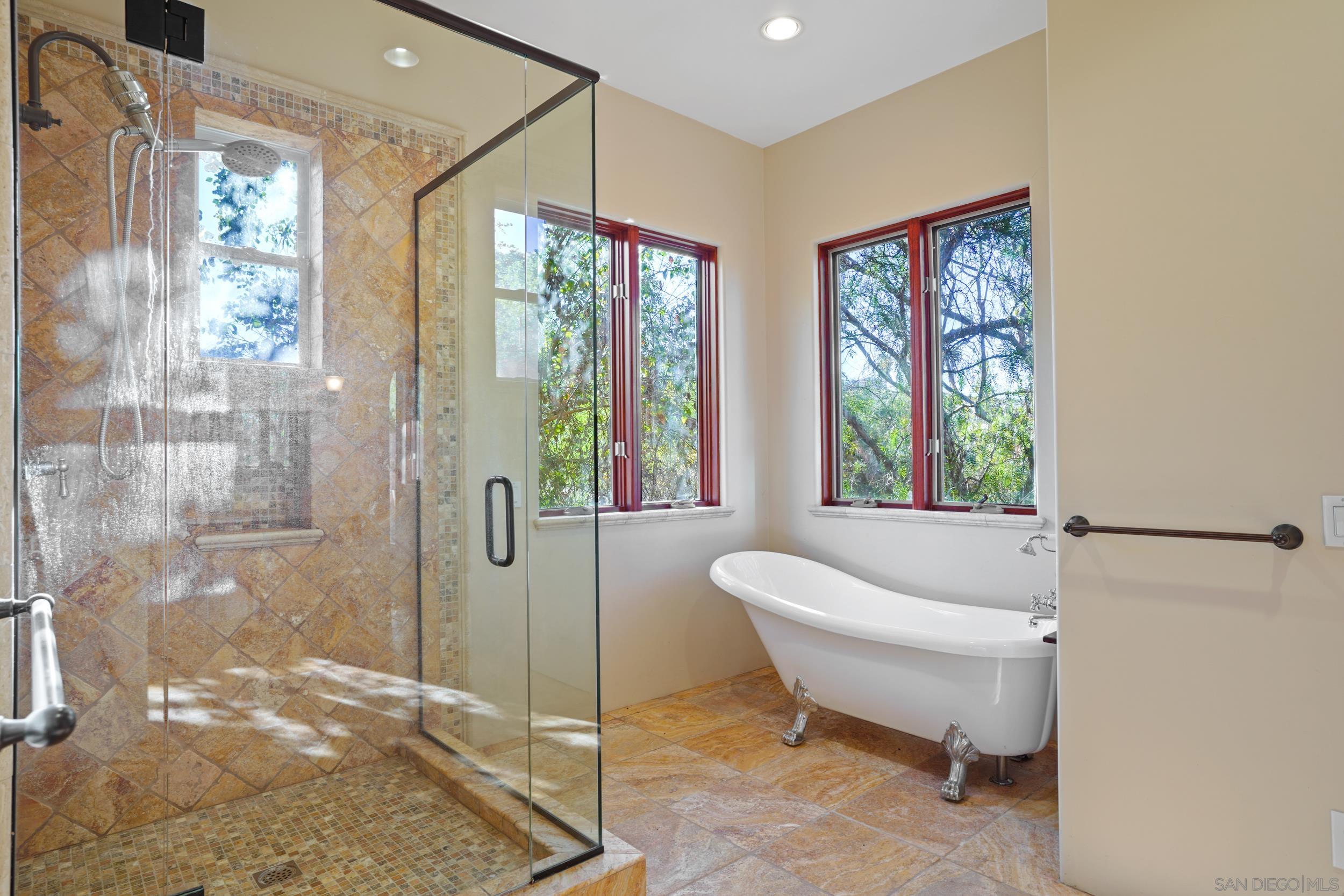 5352 Camino Jasmine Bonsall, CA 92003 - Photo 23 of 68 a spacious bathroom with a bathtub and shower