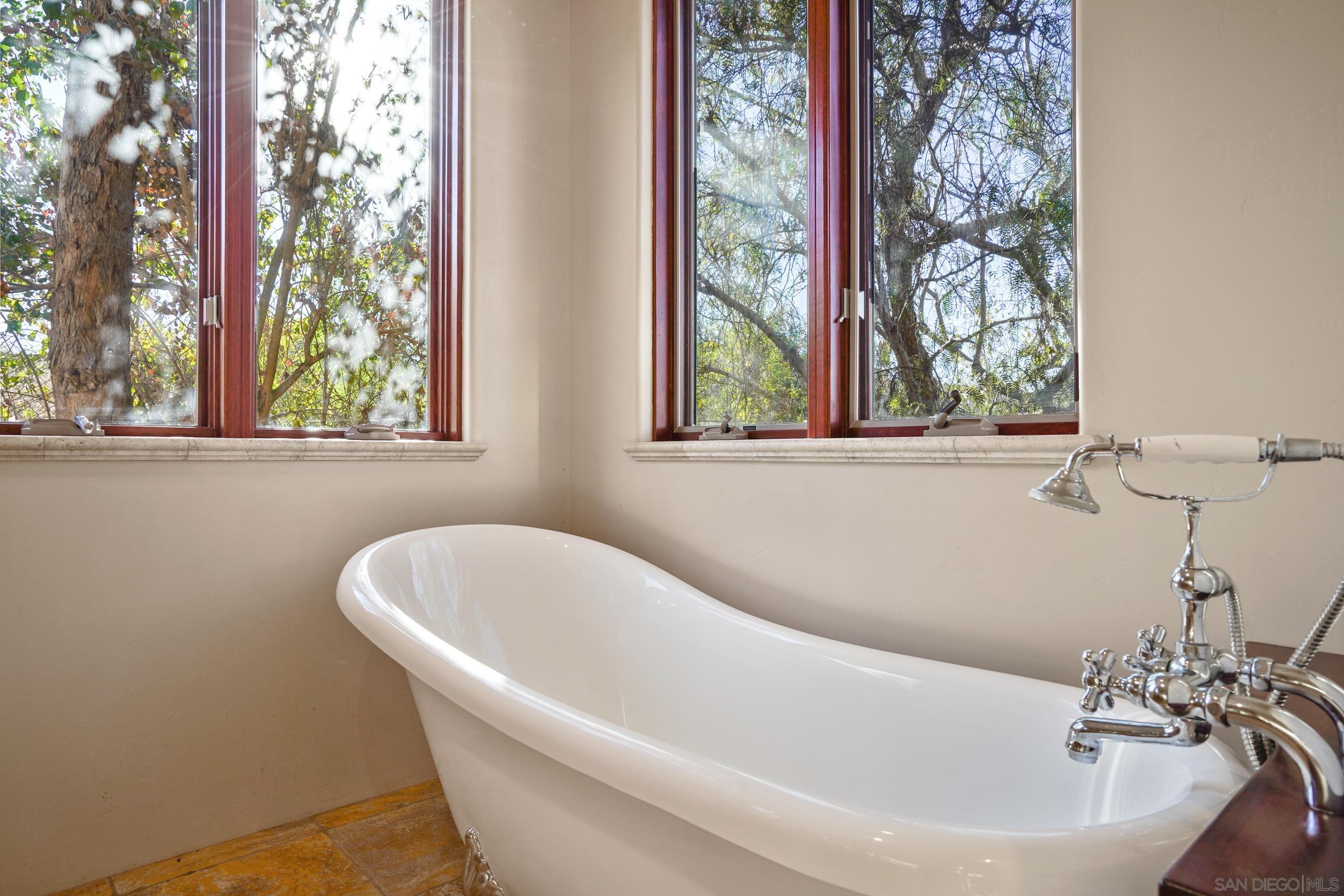5352 Camino Jasmine Bonsall, CA 92003 - Photo 24 of 68 a white bath tub sitting next to a window