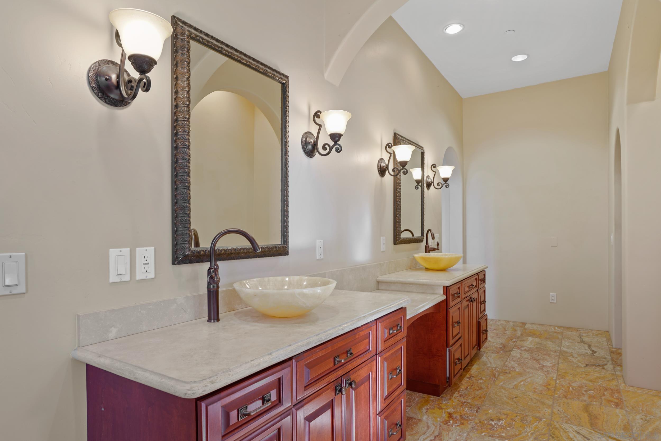 5352 Camino Jasmine Bonsall, CA 92003 - Photo 25 of 68 a bathroom with a sink and a mirror