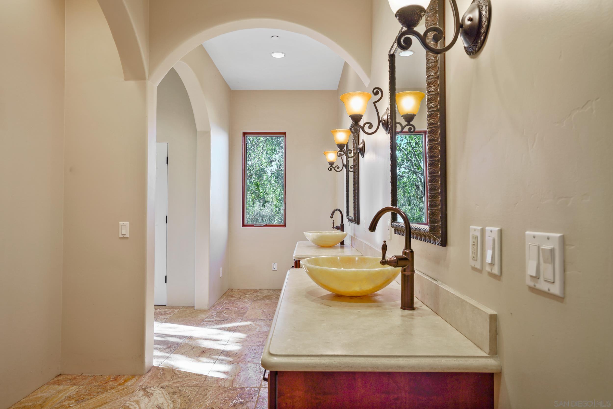 5352 Camino Jasmine Bonsall, CA 92003 - Photo 26 of 68 a living room with furniture and a chandelier