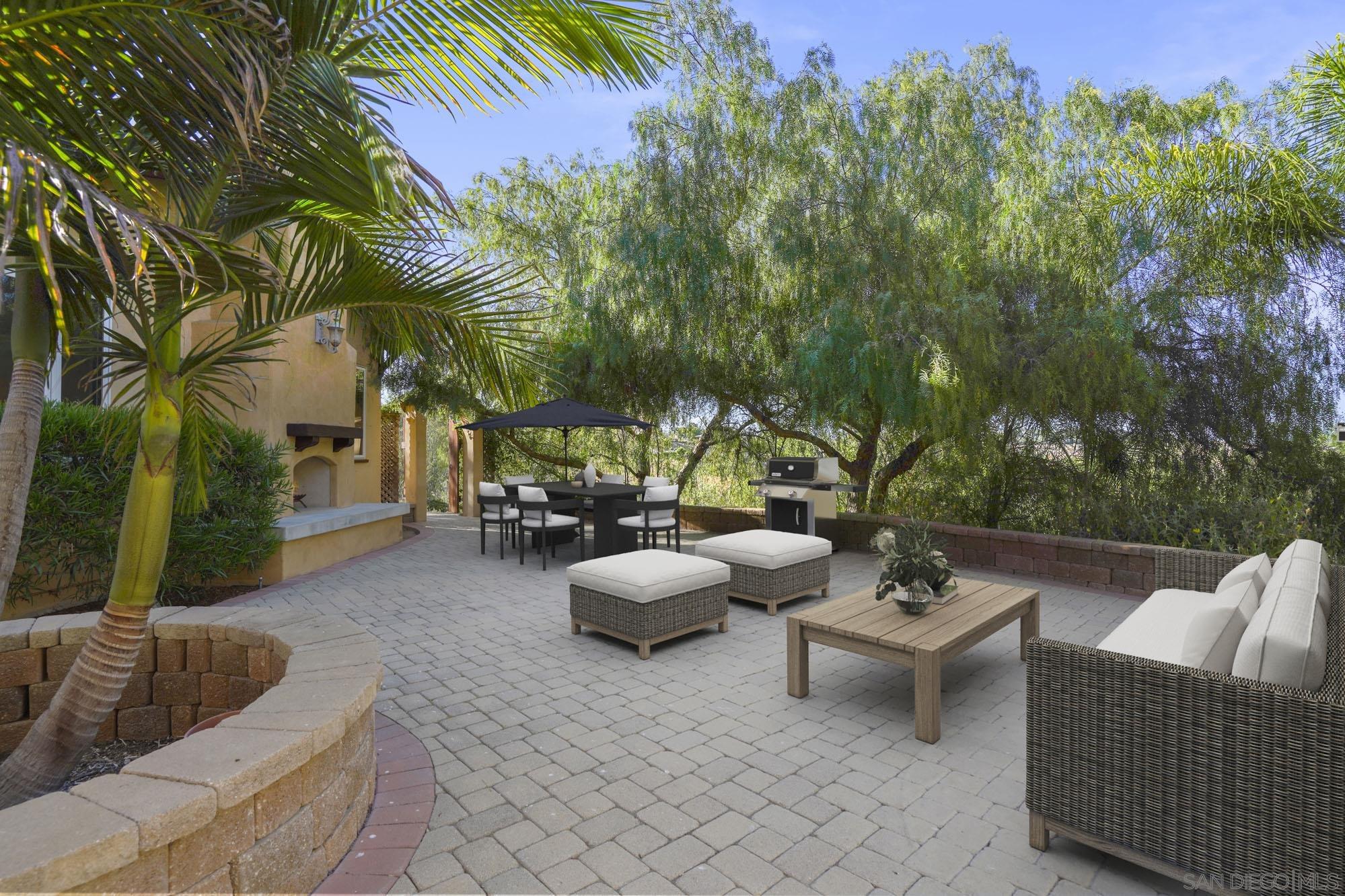 5352 Camino Jasmine Bonsall, CA 92003 - Photo 34 of 68 a view of a patio with couches and a potted plant on a table and chair