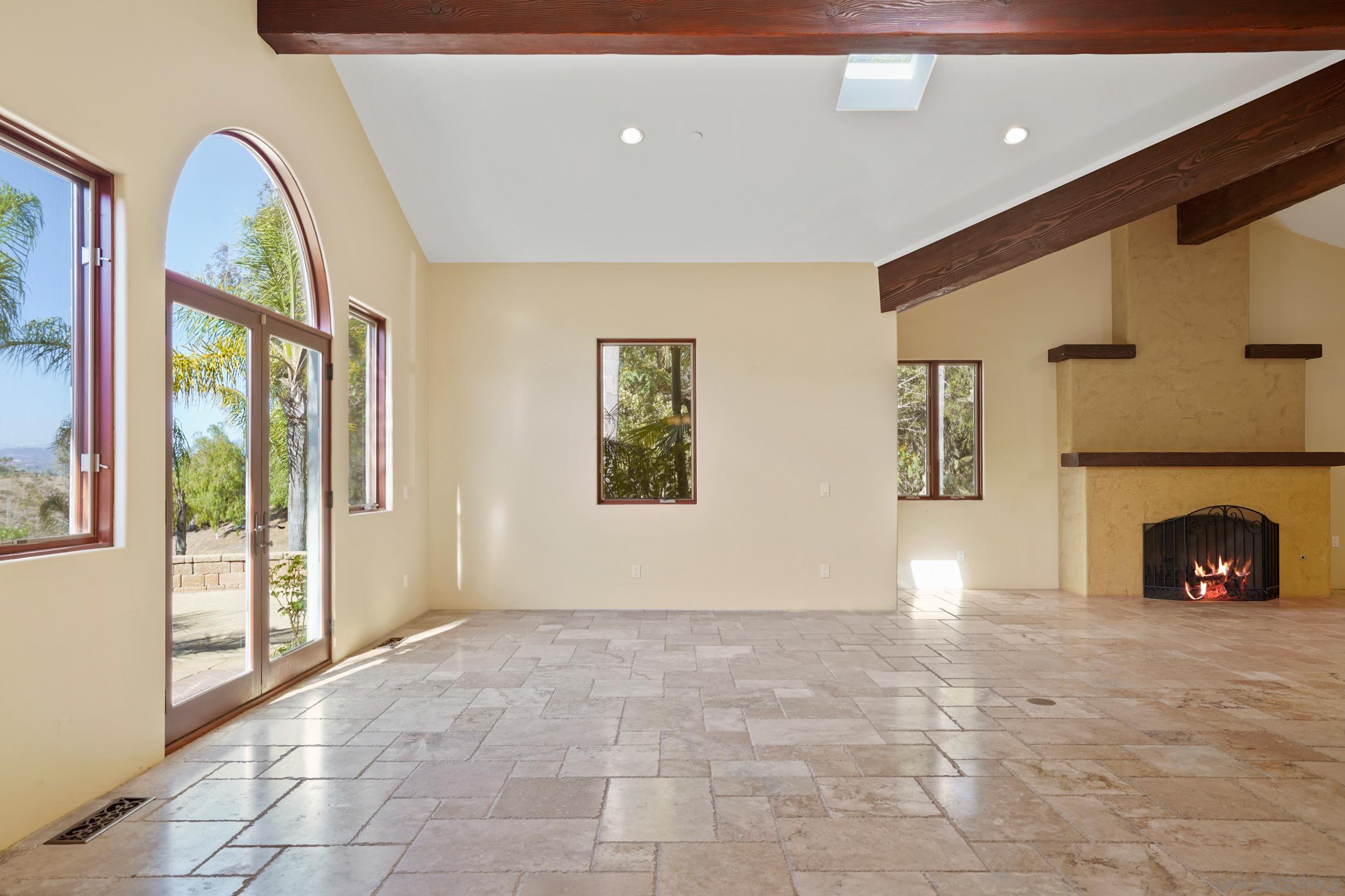 5352 Camino Jasmine Bonsall, CA 92003 - Photo 50 of 68 a view of a livingroom with a fireplace and window