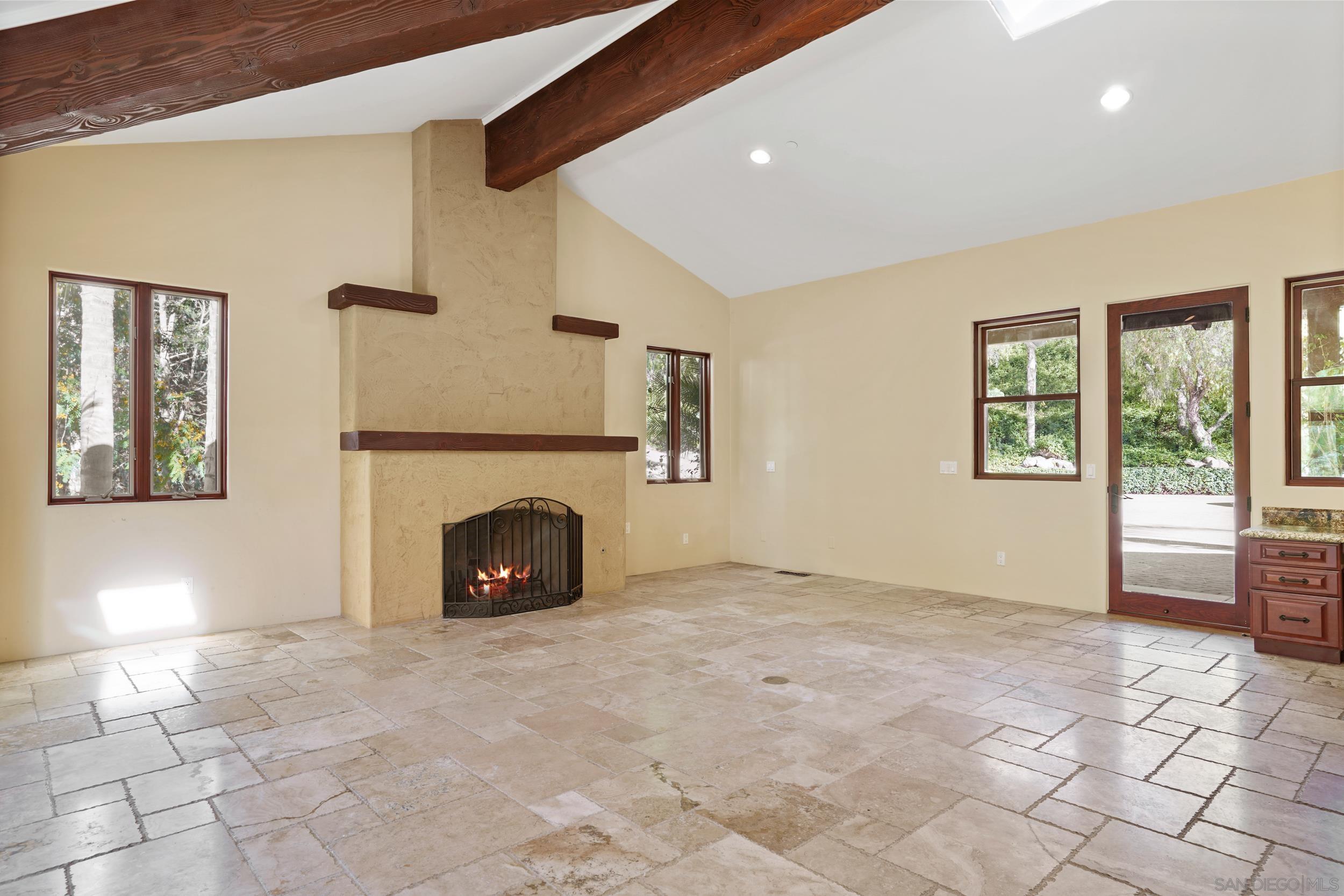 5352 Camino Jasmine Bonsall, CA 92003 - Photo 54 of 68 a view of a livingroom with an empty space and a fireplace