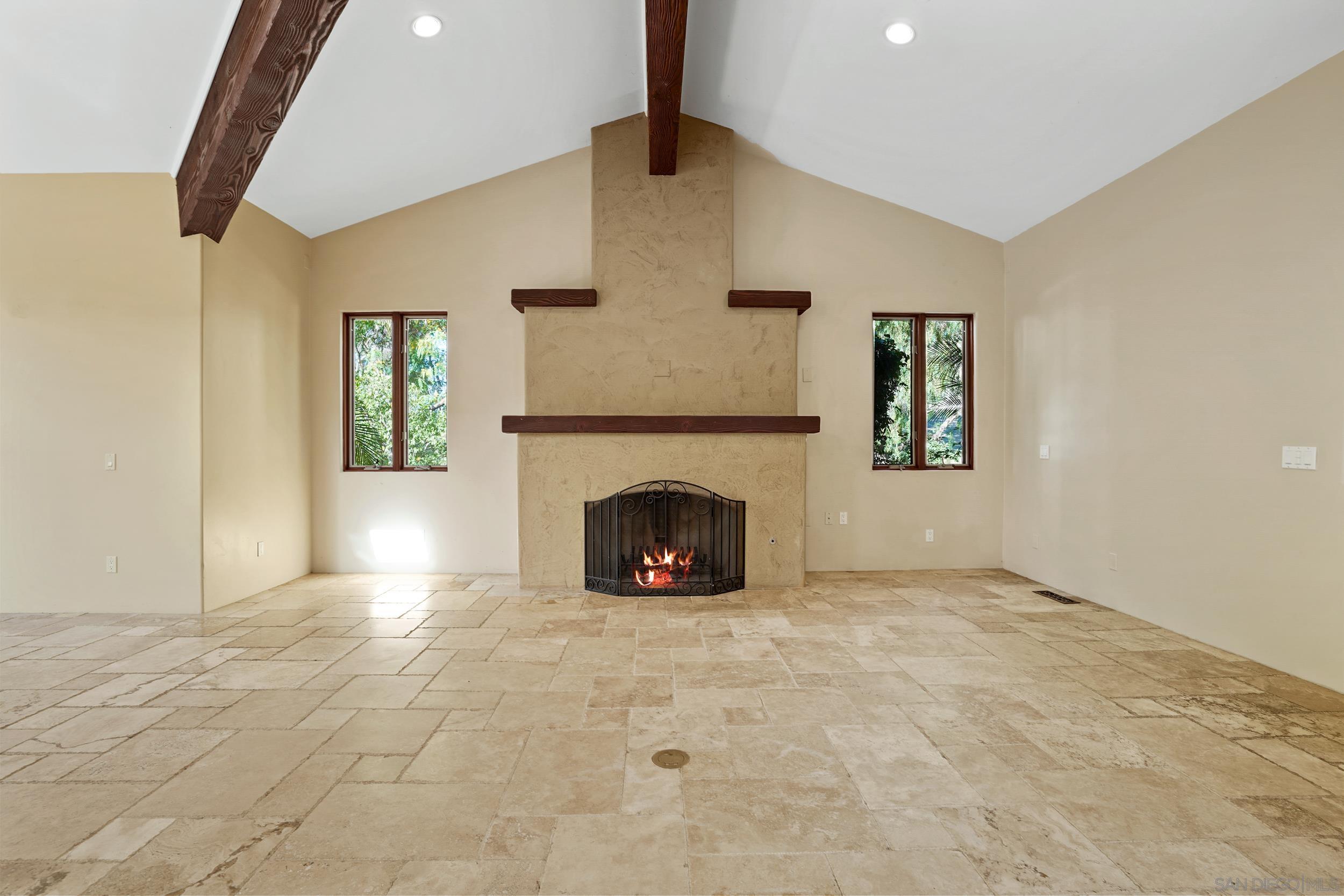 5352 Camino Jasmine Bonsall, CA 92003 - Photo 56 of 68 a view of a livingroom with a fireplace and window