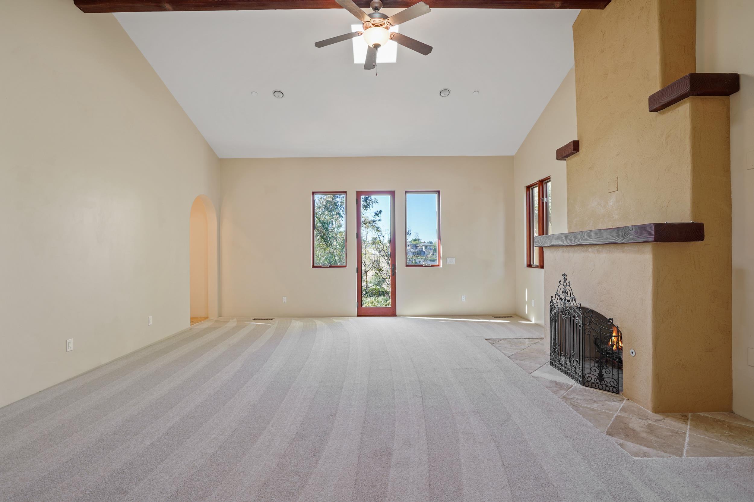 5352 Camino Jasmine Bonsall, CA 92003 - Photo 63 of 68 wooden floor in an empty room with a fireplace
