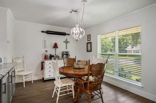 a dining room with furniture and window