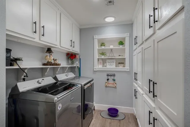 a utility room with cabinets