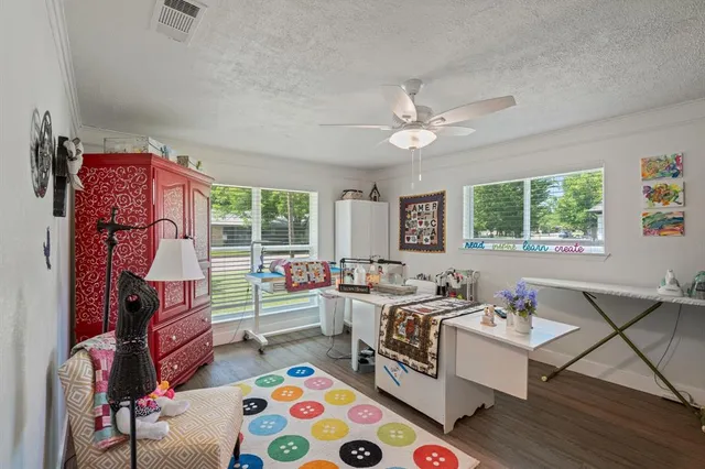 a bedroom with furniture and a window
