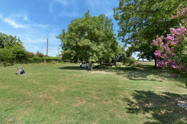 a view of outdoor space with deck and yard