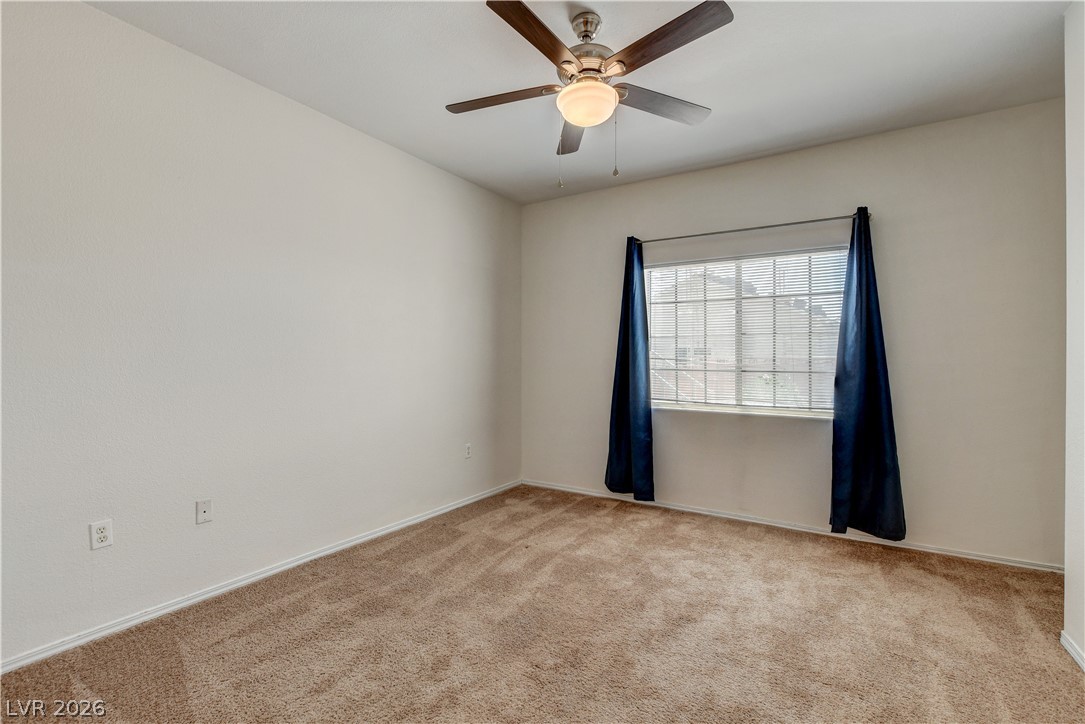 3318 North Decatur Boulevard, Unit 1069 Las Vegas, NV 89130 - Photo 23 of 39 A well-proportioned bedroom with ample natural light and plush carpeting.