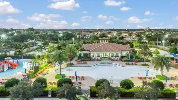 an outdoor space with lots of palm trees