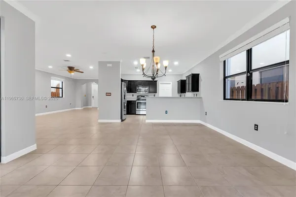a view of a kitchen with a sink and a stove top oven