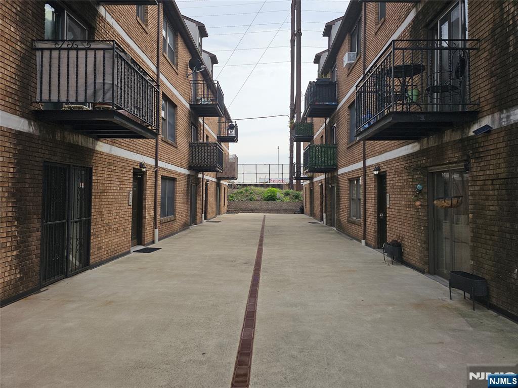 63-69 Rome Street Newark, NJ 07105 - Photo 2 of 14 a view of a house with a street