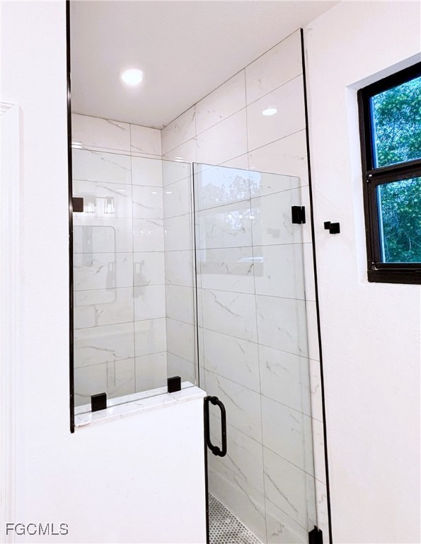 113 Monroe Avenue Lehigh Acres, FL 33936 - Photo 13 of 24 a bathroom with a bathtub and shower