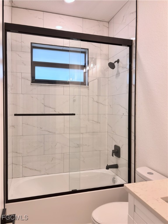 113 Monroe Avenue Lehigh Acres, FL 33936 - Photo 18 of 24 a bathroom with a bathtub and a shower