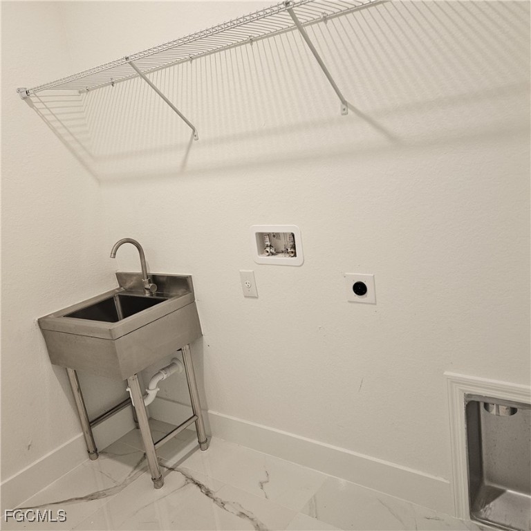 113 Monroe Avenue Lehigh Acres, FL 33936 - Photo 20 of 24 a bathroom with a sink and mirror
