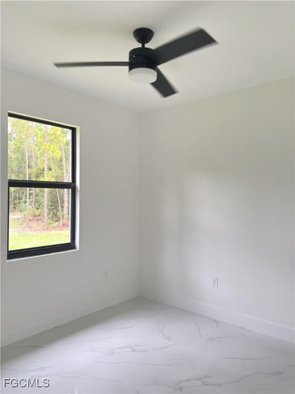 113 Monroe Avenue Lehigh Acres, FL 33936 - Photo 6 of 24 an empty room with a window
