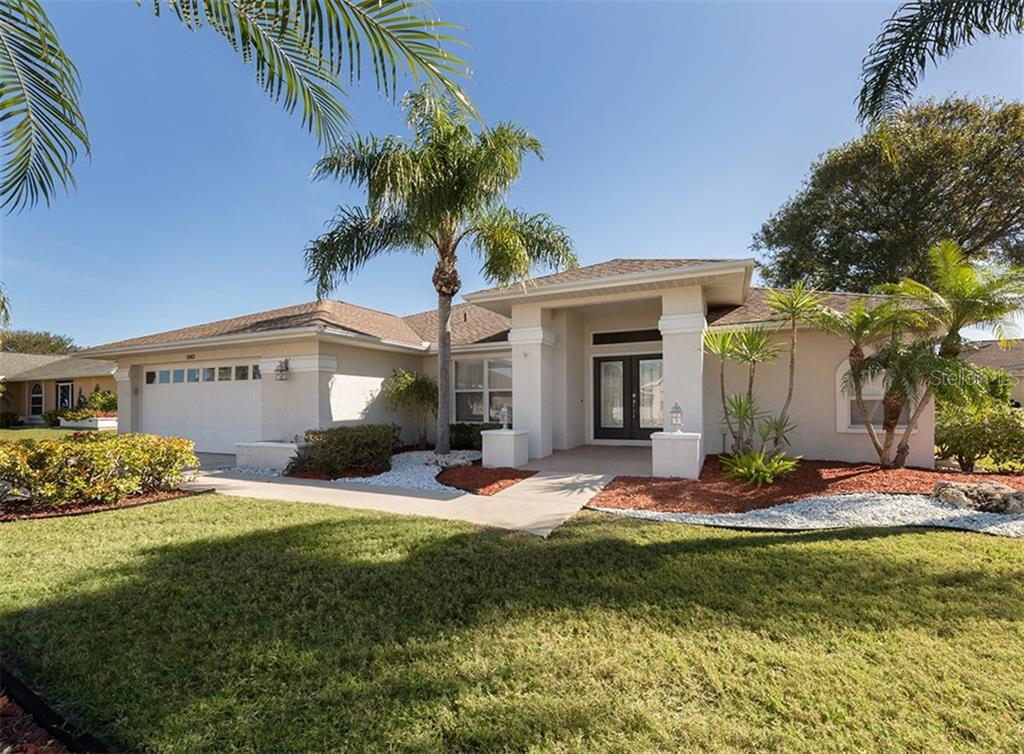 5863 Jefferson Road Venice, FL 34293 - Photo 1 of 1 a view of a house with a yard